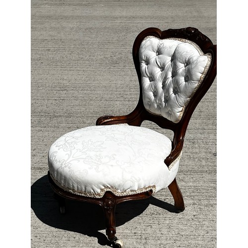 45 - Victorian upholstered nursing chair, with a carved mahogany frame.

This lot is collection only