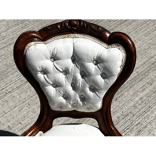 45 - Victorian upholstered nursing chair, with a carved mahogany frame.

This lot is collection only