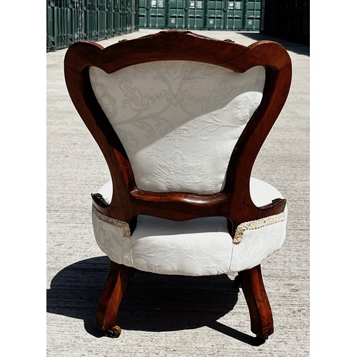 45 - Victorian upholstered nursing chair, with a carved mahogany frame.

This lot is collection only