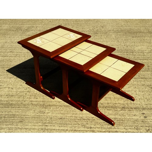 48 - Mid century furniture, a nest of tables with tiled tops

This lot is collection only