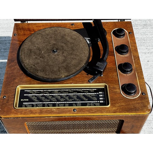 53 - Art Deco wooden cased music centre comprising a record player, radio and speaker within a single uni... 