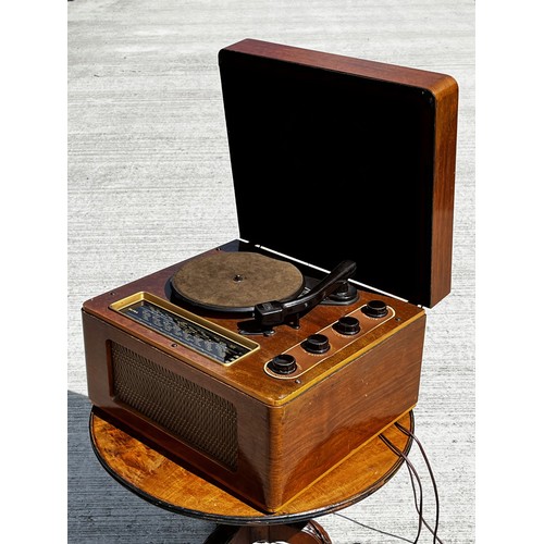 53 - Art Deco wooden cased music centre comprising a record player, radio and speaker within a single uni... 