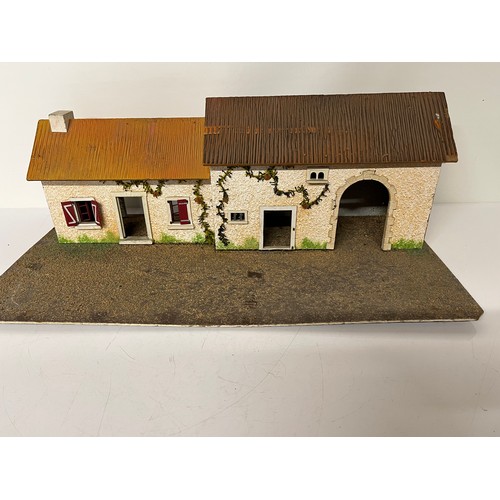 231 - Painted wooden toy house and barn, 24 inches wide.

This lot is available for in-house shipping