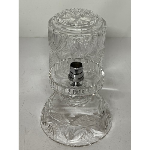 57 - Decorative clear glass table lamp and glass shade. 11 inches high 6 inches in diameter.

This lot is... 