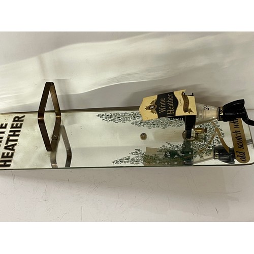 245 - Breweryania, Mirror backed White Heather Scotch Whisky dispenser. 22 inches high.

This lot is avail... 