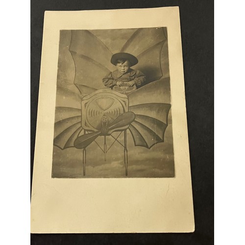 273 - Studio photo postcard of a young lad in a flying machine set, and an early plane under construction
... 