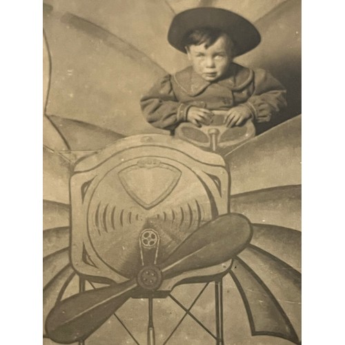 273 - Studio photo postcard of a young lad in a flying machine set, and an early plane under construction
... 