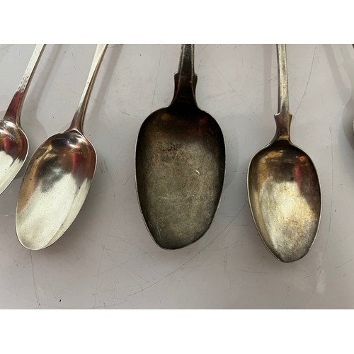 286 - Eight serving spoons, seven with english silver hallmarks and one without, 504 grams and the largest... 