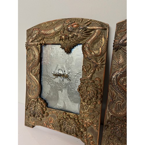 287 - Two plated copper picture frames decorated with three toed Dragons and Chrysanthemums, each is 10 in... 