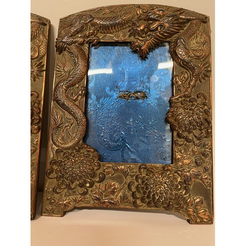 287 - Two plated copper picture frames decorated with three toed Dragons and Chrysanthemums, each is 10 in... 