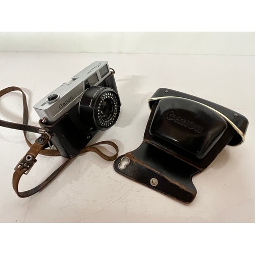 294 - Cased Cannon 35mm camera, an early Canonet model Canon camera 

This lot is available for in-house s... 