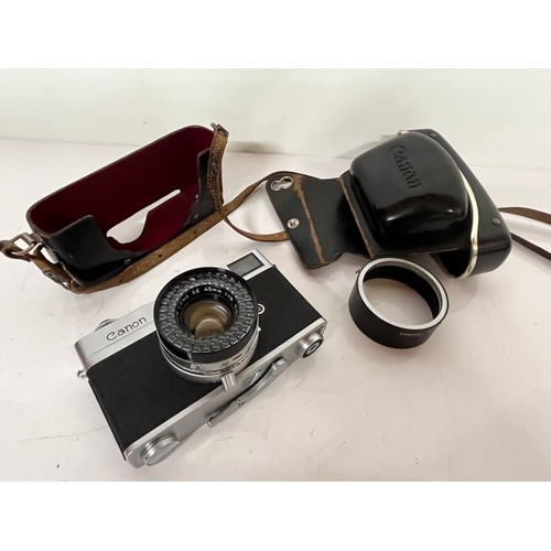 294 - Cased Cannon 35mm camera, an early Canonet model Canon camera 

This lot is available for in-house s... 