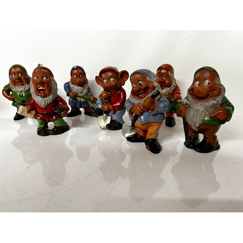 297 - Walt Disney painted terracotta figurines of the Seven Dwarfs from the Disney animated classic, each ... 