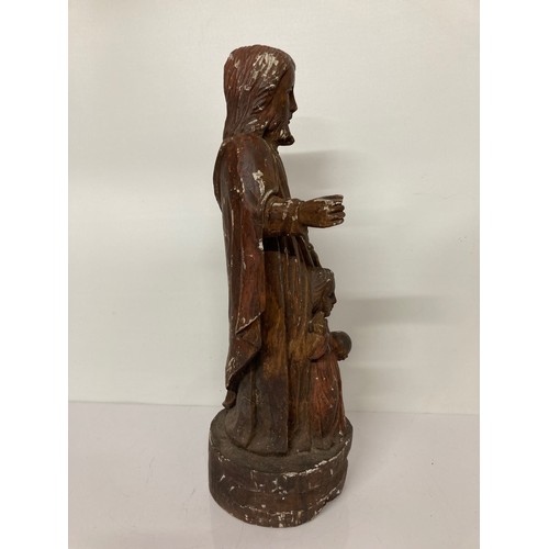 329 - C19th religious carved wooden figures of a man and a boy with painted jesso surface finish. 20 inche... 