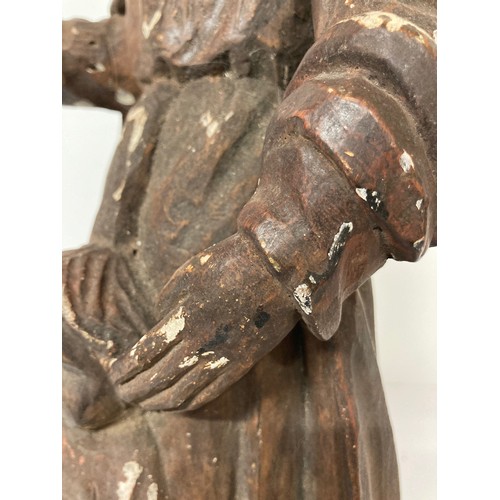 329 - C19th religious carved wooden figures of a man and a boy with painted jesso surface finish. 20 inche... 