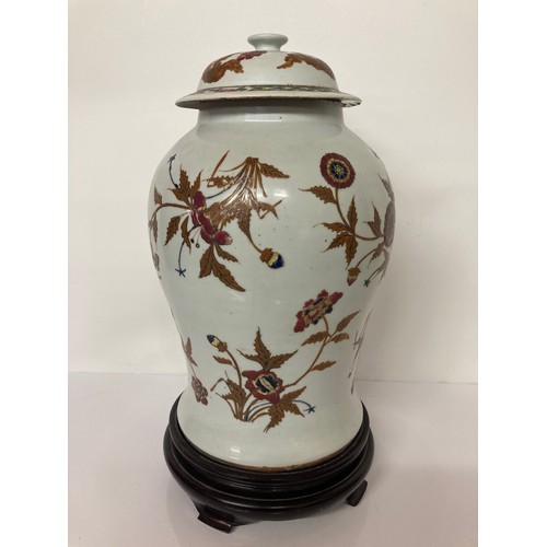 330 - Chinese pottery lidded vase on later stand, 16 inches high. Chip to underside of the lid and hairlin... 