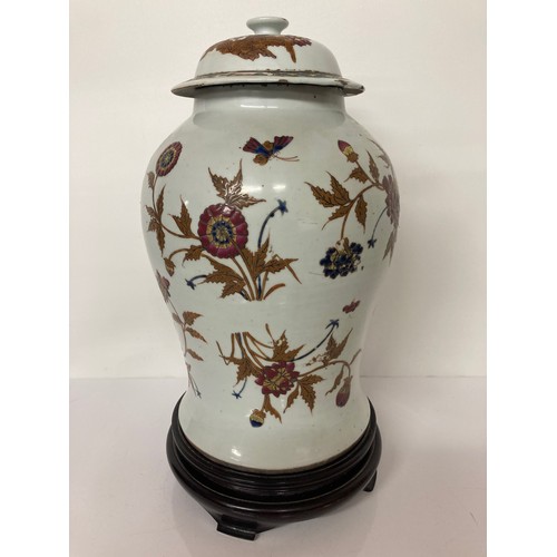 330 - Chinese pottery lidded vase on later stand, 16 inches high. Chip to underside of the lid and hairlin... 