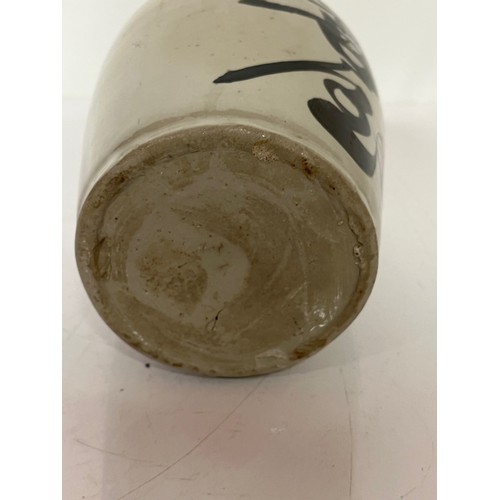 331 - Oriental stoneware Saki bottle, glazed lettering to front and rear. 10 inches high.

This lot is ava... 