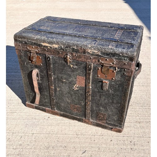 7 - Leather covered trunk with wood and metal bindings and inner tray, monogramed plaque to the top date... 