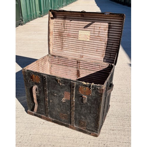 7 - Leather covered trunk with wood and metal bindings and inner tray, monogramed plaque to the top date... 