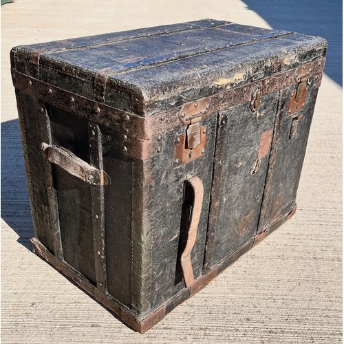 7 - Leather covered trunk with wood and metal bindings and inner tray, monogramed plaque to the top date... 