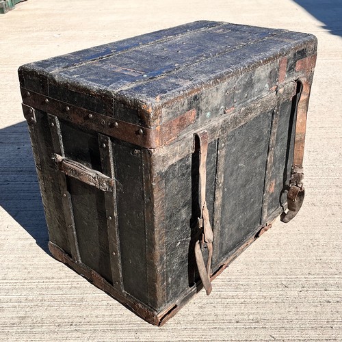 7 - Leather covered trunk with wood and metal bindings and inner tray, monogramed plaque to the top date... 