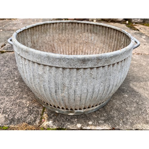 9 - Unusual small galvanised steel wash tub, only 17 inches in diameter and 10 inches high.

This lot is... 