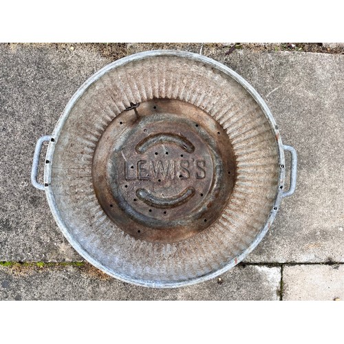 9 - Unusual small galvanised steel wash tub, only 17 inches in diameter and 10 inches high.

This lot is... 