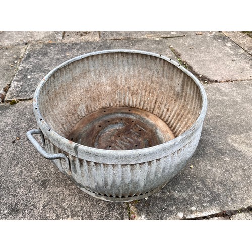 9 - Unusual small galvanised steel wash tub, only 17 inches in diameter and 10 inches high.

This lot is... 