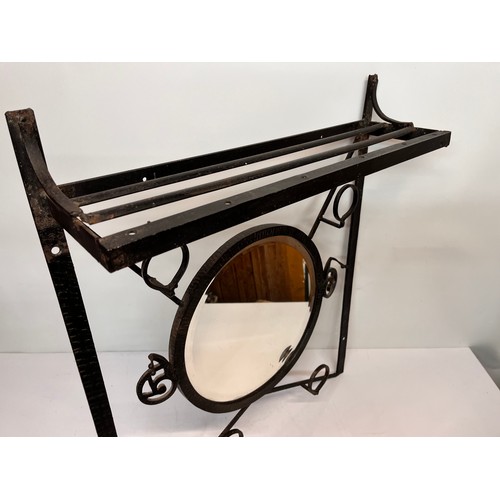 12 - Artisan made Arts and Crafts wrought iron unit, hat and coat rail with hall mirror to the centre, de... 