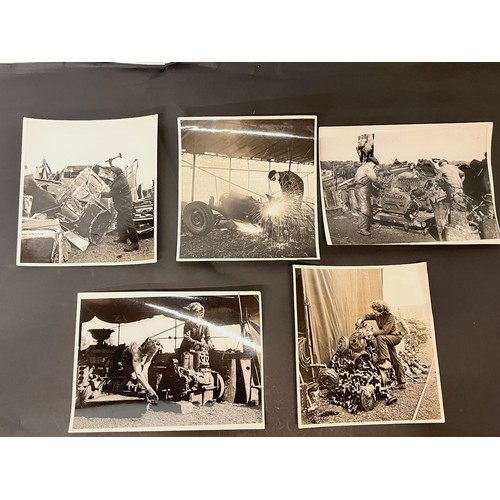 70 - Militaria, series of large press photographs showing the recycling of scrap metal, some of the work ... 