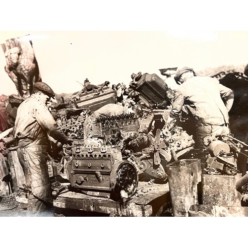 70 - Militaria, series of large press photographs showing the recycling of scrap metal, some of the work ... 