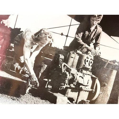 70 - Militaria, series of large press photographs showing the recycling of scrap metal, some of the work ... 