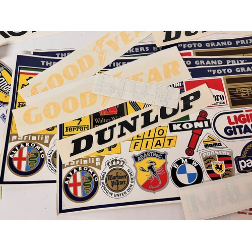 85 - Automobilia, vintage motor racing rally stickers Gwyndaf Evans sponsorship tyres etc. 50+

This lot ... 