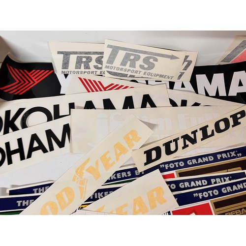 85 - Automobilia, vintage motor racing rally stickers Gwyndaf Evans sponsorship tyres etc. 50+

This lot ... 