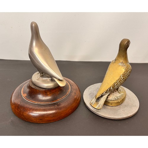 99 - Automobilia, two racing pigeon mascots wooden base is 12 cm in diameter and the metal one is 10 cm i... 