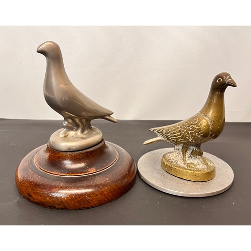 99 - Automobilia, two racing pigeon mascots wooden base is 12 cm in diameter and the metal one is 10 cm i... 