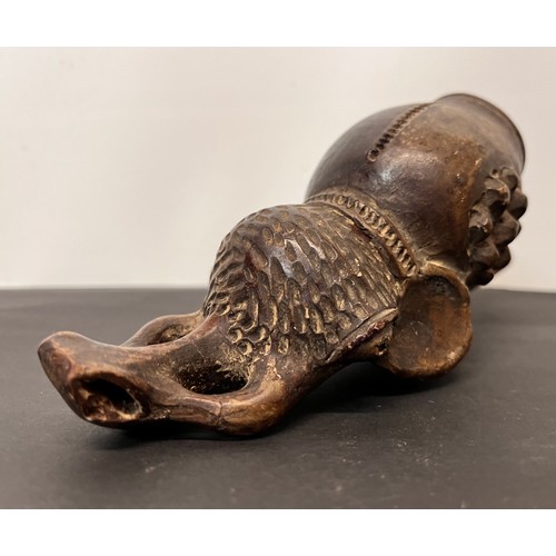 101 - Tribal art pipe in the form of an Elephant, 18cm long overall.

This lot is available for in-house s... 