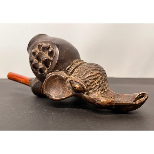 101 - Tribal art pipe in the form of an Elephant, 18cm long overall.

This lot is available for in-house s... 