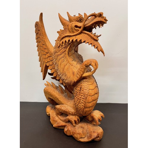 112 - Large carved wooden figure of a Dragon 34 cm high.


This lot is available for in-house shipping