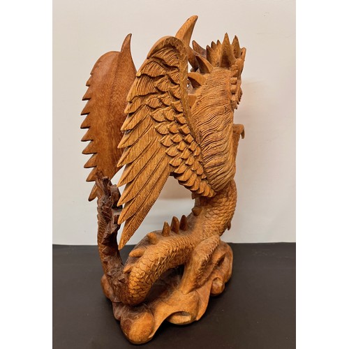 112 - Large carved wooden figure of a Dragon 34 cm high.


This lot is available for in-house shipping