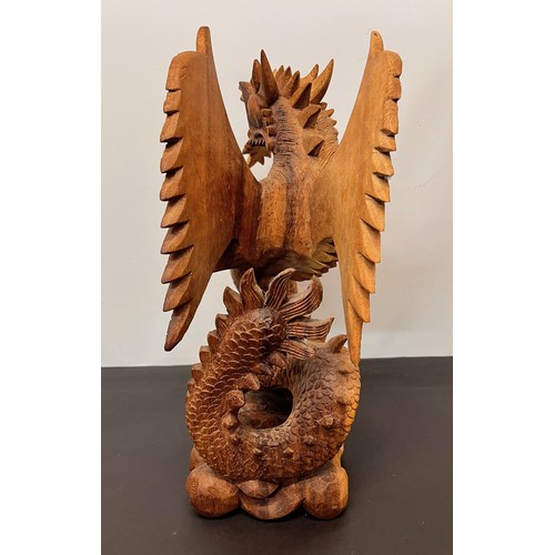 112 - Large carved wooden figure of a Dragon 34 cm high.


This lot is available for in-house shipping