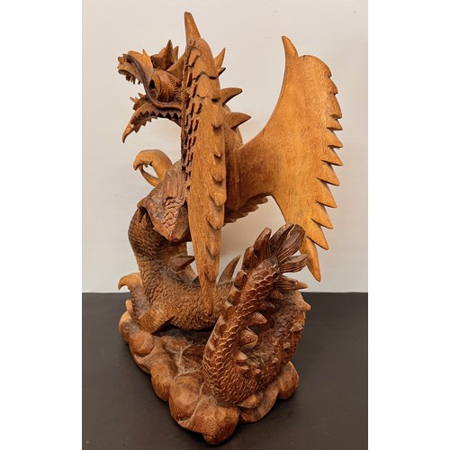 112 - Large carved wooden figure of a Dragon 34 cm high.


This lot is available for in-house shipping