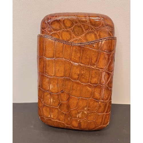 114 - Crocodile skin cigar case 6 inches long

This lot is available for in-house shipping