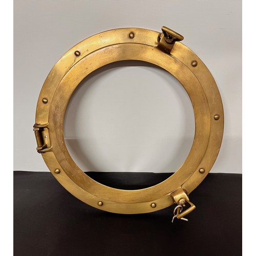 129 - Brass port hole 38 cm wide overall.


This lot is available for in-house shipping