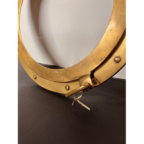 129 - Brass port hole 38 cm wide overall.


This lot is available for in-house shipping