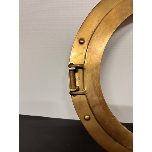 129 - Brass port hole 38 cm wide overall.


This lot is available for in-house shipping