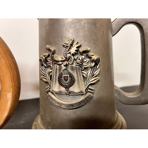 137 - Three tankards, two in pewter and a bamboo example that has been used as a brush pot.

This lot is a... 