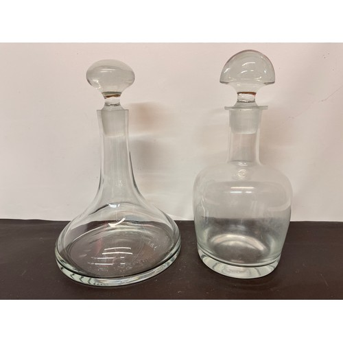 139 - Two Mid century designer glass decanters each 30 cm high.

This lot is available for in-house shippi... 