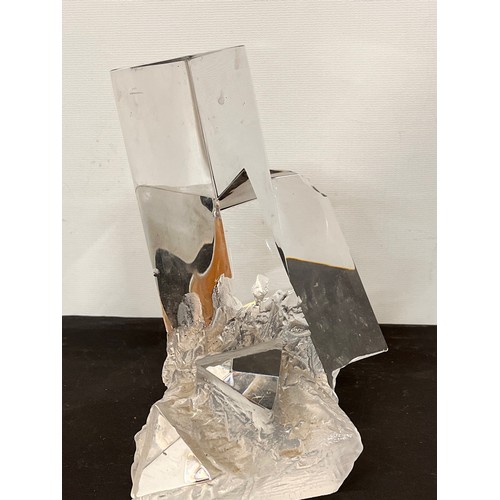 141 - Modernist glass sculpture of cubist forms emerging from a rock structure at the base. 18 cm high.

T... 